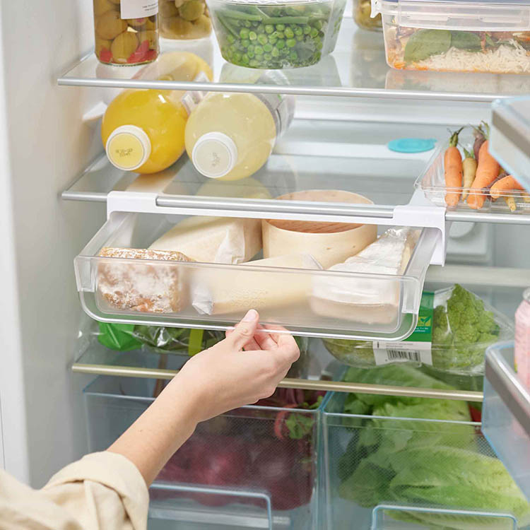 Udtrækkelig hylde til køleskabet billede